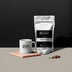 Coffee bag and mug with 'S5 Coffee' branding on a dark background